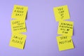 Paper notes with life-affirming phrases on violet background. Space for text