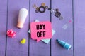 Paper notes with text DAY OFF on blue background Royalty Free Stock Photo