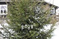 Paper numbers 2018 on fir tree green branches. Royalty Free Stock Photo