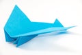 PAPER ORIGAMI AIRPLANE OVER WHITE BACKGROUND Royalty Free Stock Photo