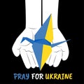 Paper origami crane in colors of Ukrainian flag on open childrens hands. Concept of humanity and peace, against war in Ukraine.