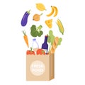 Paper package with fresh food and drink products. Vegetables, fruit, cheese, baguette, dairy products.