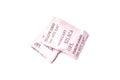 Paper packet of silica gel isolated on white Royalty Free Stock Photo