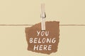 You belong here    A paper on the pegs. And this is the word written Royalty Free Stock Photo