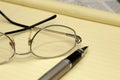 Paper, pen and glasses in an office. Royalty Free Stock Photo