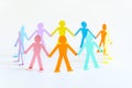 Paper people chain concept of social help and togetherness in group Royalty Free Stock Photo