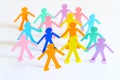 Paper people chain concept of social help and togetherness in group Royalty Free Stock Photo