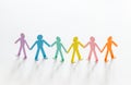 Paper people chain concept of social help and togetherness in group Royalty Free Stock Photo
