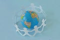 Paper people in a circle around earth globe on blue background - Royalty Free Stock Photo