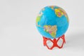 Paper people in a circle holding earth globe - Save the world co Royalty Free Stock Photo