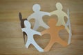 Paper people in a circle holding hands - Anti-racism and love co Royalty Free Stock Photo