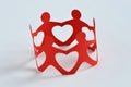 Paper people in a circle holding hands - Teamwork and love concept Royalty Free Stock Photo