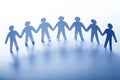 Paper people standing together hand in hand. Team Royalty Free Stock Photo