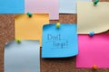 Paper with phrase Don`t Forget and empty colorful notes pinned to cork board Royalty Free Stock Photo
