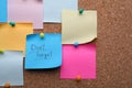 Paper with phrase Don`t Forget and empty colorful notes pinned to cork board, space for text Royalty Free Stock Photo