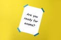 Paper with phrase Are You Ready For Exams on yellow background, top view Royalty Free Stock Photo