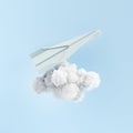 Paper plane flying over cloud