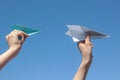 Hands on sky background hold paper planes