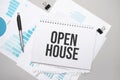 Paper plate with text Open House. Diagram, notepad and blue background Royalty Free Stock Photo