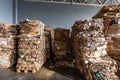 Paper pressed bales at the modern waste hazardous processing plant. Separate garbage collection. Recycling and storage of waste Royalty Free Stock Photo