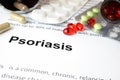 Paper with psoriasis and pills. Royalty Free Stock Photo