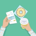 Paper receipt in man hand, coffee to go, donut. Restaurant bill paying. Customer`s payment for cafe service. Cashier check Royalty Free Stock Photo