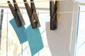 Paper for records on a clothesline attached with wooden clothespins, white paper sheets for notes