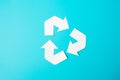 Paper Recycle logo cutout on blue background. Environmental Protection, Zero waste, Reusable, Say No Plastic, World Environment Royalty Free Stock Photo