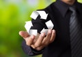 Paper recycle sign in businessman hand