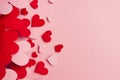 Paper red and pink hearts soar on soft pink color background. Valentine day concept for design, copy space.