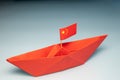 Paper red ship with China flag, China pacific fleet concept, Middle country sea shipping, Water transportation Royalty Free Stock Photo