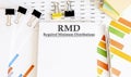 Paper with Required Minimum Distributions RMD on a table Royalty Free Stock Photo