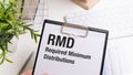 Paper with Required Minimum Distributions RMD on a table Royalty Free Stock Photo