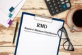 Paper with Required Minimum Distributions RMD on a table Royalty Free Stock Photo