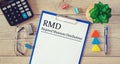 Paper with Required Minimum Distributions RMD on a table Royalty Free Stock Photo