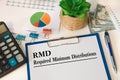 Paper with Required Minimum Distributions RMD on a table Royalty Free Stock Photo