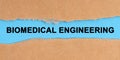 The paper is ripped in the middle. Inside on a blue background it is written - Biomedical Engineering Royalty Free Stock Photo