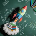 Paper Rocket Lifting Off Blackboard in Creative Back to School Scene. Royalty Free Stock Photo