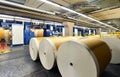 Paper rolls and offset printing machines in a large print shop for production of newspapers & magazines Royalty Free Stock Photo