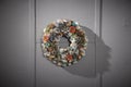 Paper holiday wreath on grey