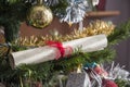 Paper scroll, wishlist rolled up on christmas tree. Beautiful cl Royalty Free Stock Photo