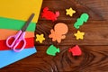 Paper sea animals - octopus, fish, starfish, seahorse, crab. Sheets of colored paper, scissors on wooden background