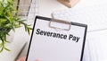 Paper with Severance Pay on a table. Business concept Royalty Free Stock Photo