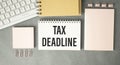 Paper sheet with text TAX DEADLINE, calculator Royalty Free Stock Photo