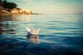 Paper Ship Floating in the Sea. Toned Photo. Royalty Free Stock Photo