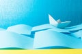 Paper ship in the paper sea. Concept of the theme of bureaucracy Royalty Free Stock Photo