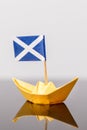 Paper ship with scots flag Royalty Free Stock Photo