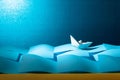 Paper ship in the paper sea. Concept of the theme of bureaucracy Royalty Free Stock Photo