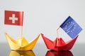 Paper ship with swiss and european flag Royalty Free Stock Photo