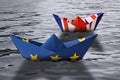 Paper ships made as European Union and British flags sailing side by side in the water - concept showing England and European Unio Royalty Free Stock Photo